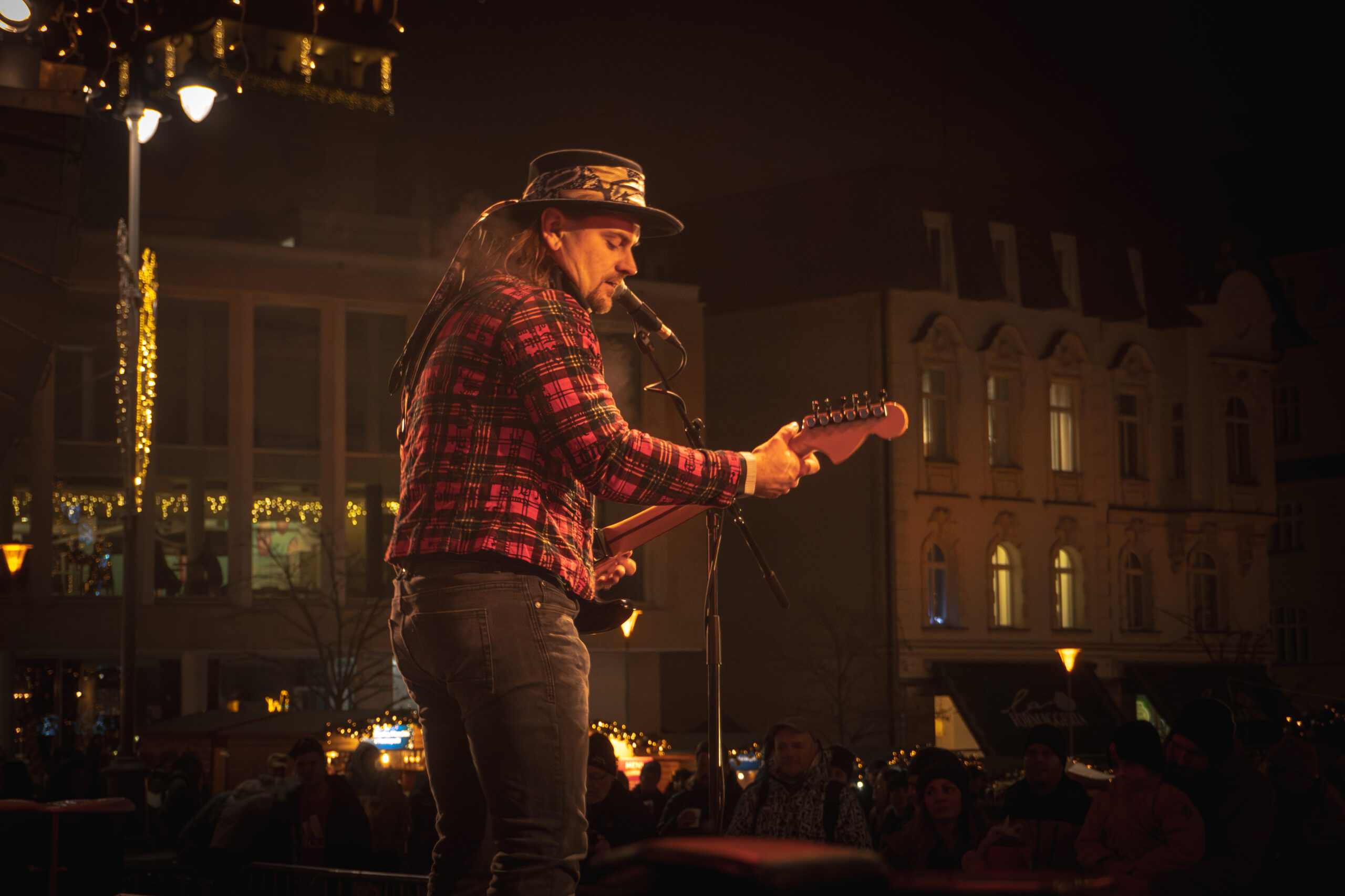 Guitarist Ondrej Malina with sunburst Fender Stratocaster at Zelny Trh Brno, Christmas Markets 2024